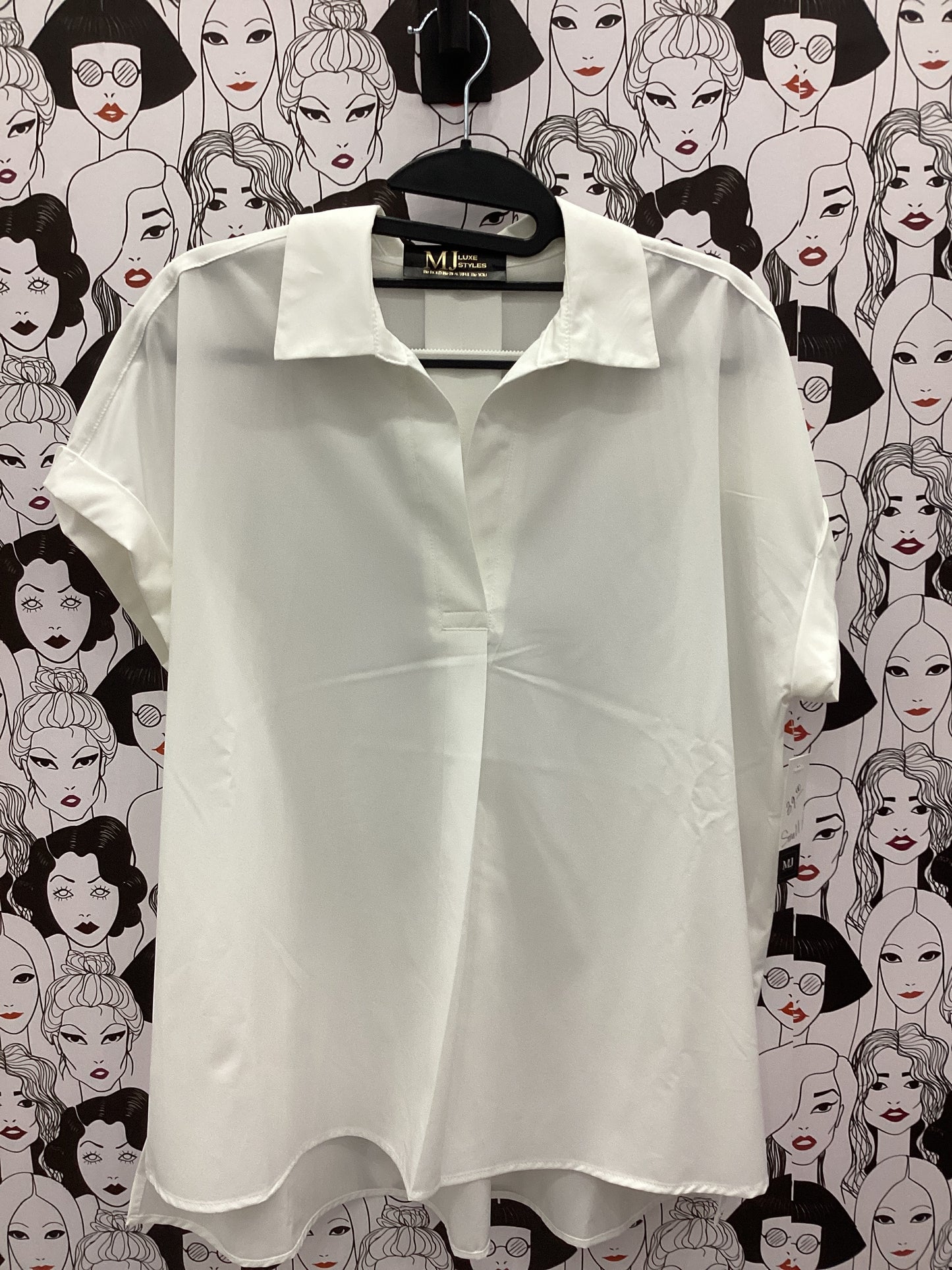 Cream sleeveless button-up