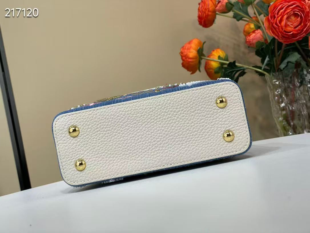 LIMITED EDITION  Louis Vuitton Capucines Mini bag in Monogram denim